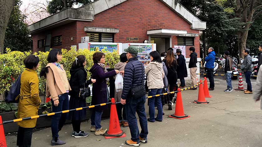 Line for toilets at a park