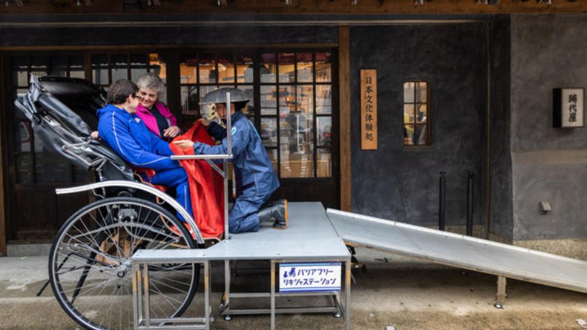 Daniel Romanchuk in an accessible rickshaw in Japan
