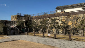 Access to the castle keep requires ascending a flight of wooden stairs.