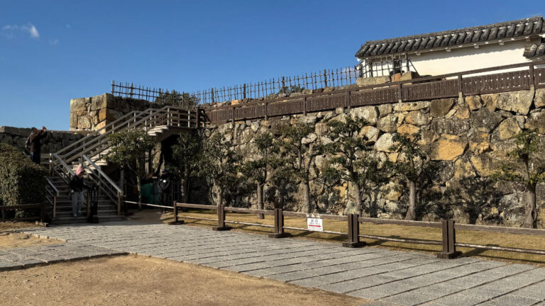 Access to the castle keep requires ascending a flight of wooden stairs.