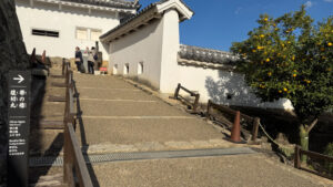 The final path to Bizenmaru is steep and uneven, with a corner partway up, and wooden railings for support.